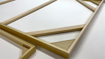 Transform interior spaces with blank canvas panels built to size, tensioned, and primed for aesthetic flexibility. Their custom sizing and gallery depth allow integration into walls or partitions. Delivered in wood crates to secure edges and corners until installation.