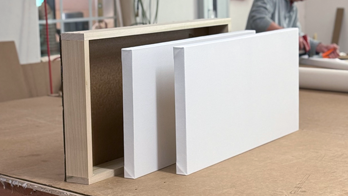 Canvas painting framing service delivers stretched, primed canvases unified with hardwood frames ready to hang. Each framed canvas is boxed in wood for protective delivery or storage. Saves time and ensures exhibition-ready presentation.